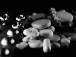 A black and white pic of a bunch of pills.